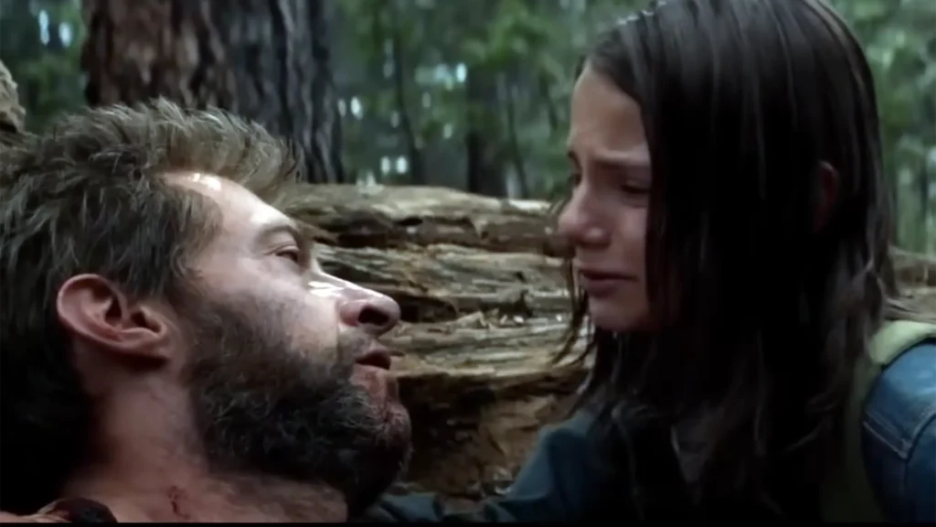 logan death scene from the movie logan where laura (x-23) holding logan's hand.