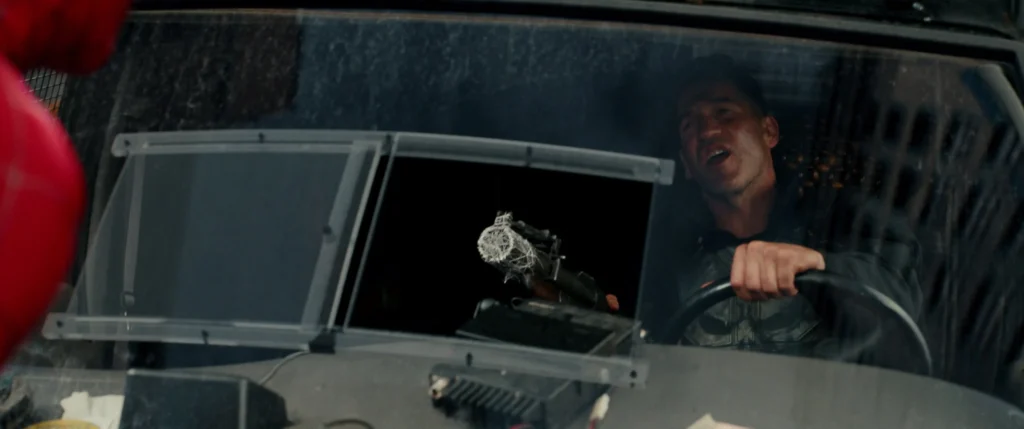 Jon Bernthal as Punisher Frank Castle driving the Battle Van webbed by Spider-Man in Brand New Day trailer