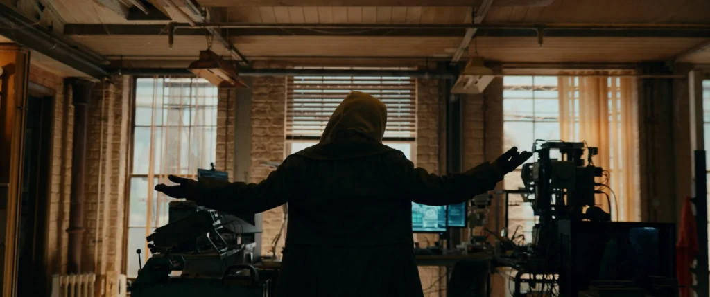 Spider-Man: Brand New Day Breaks Trailer Record And Hints At Man-Spider Transformation 2 Sadie Sink'S Hooded Character Stands With Arms Outstretched In A Cluttered Lab In Spider-Man: Brand New Day