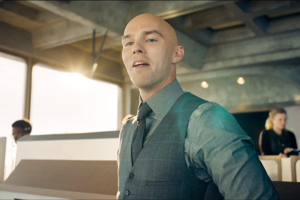 Lex Luthor Standing Tall In His Business Suit, Exuding Confidence And Villainous Intent In James Gunn'S Superman (2025).