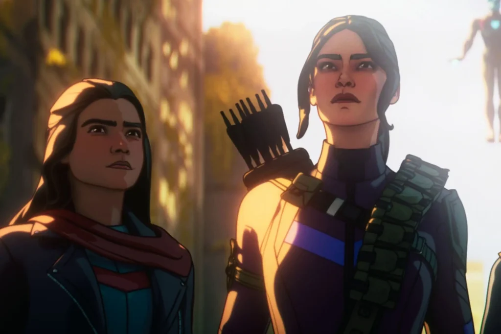 A Bright, Cinematic Shot From The Marvel Zombies Animated Series Featuring The Three Main Surviving Heroes Standing Together In A Ruined, Overgrown City Street. From Left To Right: Kamala Khan (Ms. Marvel), Kate Bishop (Hawkeye) With A Quiver Of Arrows, And Riri Williams (Ironheart) With A Glowing Chest Piece. In The Background, Floating Above Them, Is The Iron Man Mark L Armor Being Piloted By The Ai F.r.i.d.a.y.