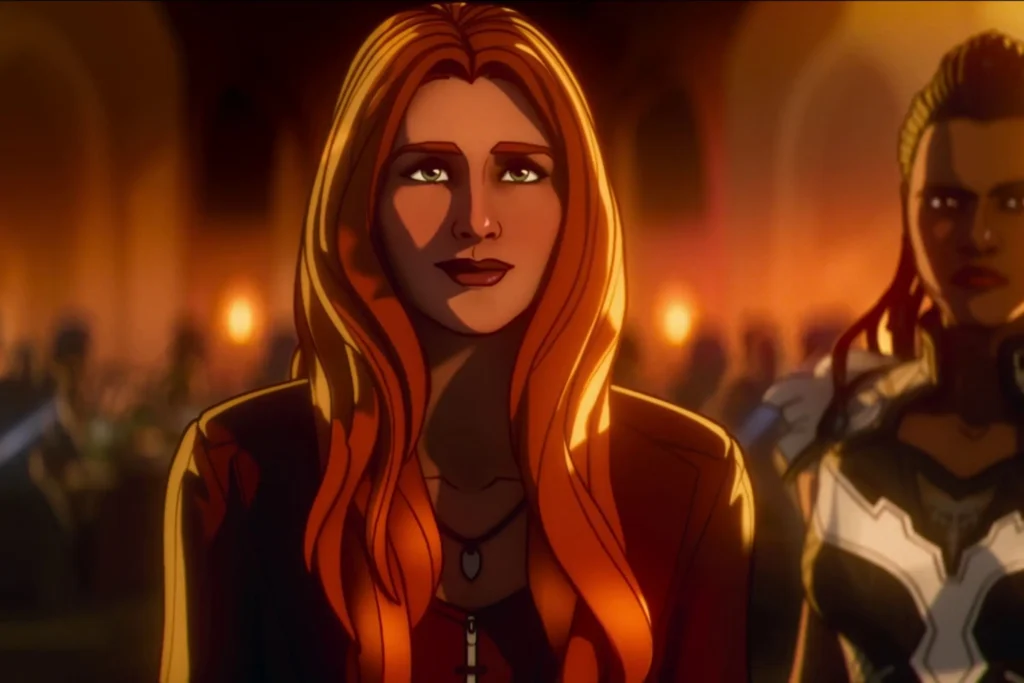 A Close-Up Shot From The Marvel Zombies Animated Series. Wanda Maximoff (Scarlet Witch) Is In The Foreground With Long Red Hair And A Red Top, Looking Calmly At The Viewer. Behind Her, Standing Watch In Armor And Holding A Staff, Is Valkyrie, The King Of New Asgard. The Background Is Dimly Lit With Warm, Orange Light And Blurred Figures Of Other Characters, Suggesting An Indoor Scene.