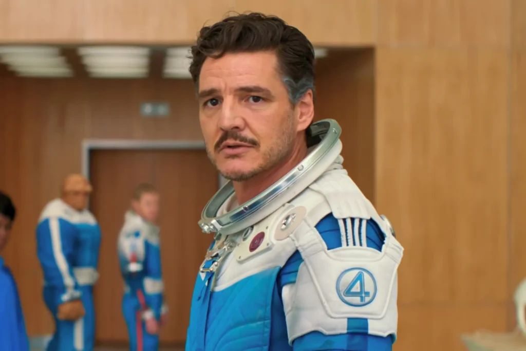 Pedro Pascal As Reed Richards Wearing White And Blue Space Suit With Number 4 Emblem And Neck Collar In The Fantastic Four: First Steps