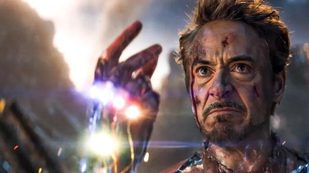 Tony Stark wielding the Infinity Gauntlet with power surge in Avengers Endgame final battle