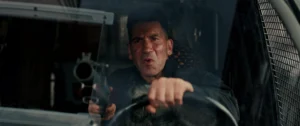 Jon Bernthal As Frank Castle The Punisher Gripping A Gun Inside A Vehicle