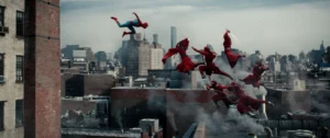 Spider-Man Leaping Toward A Group Of Red-Clad Hand Ninjas On A Rooftop Above A City Skyline