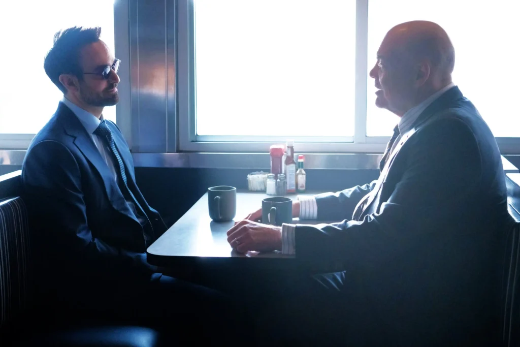 Daredevil Born Again Season 2: Everything You Need To Know Before March 24 2 Charlie Cox As Matt Murdock And Vincent D'Onofrio As Wilson Fisk Meeting At Diner In Born Again Season 1